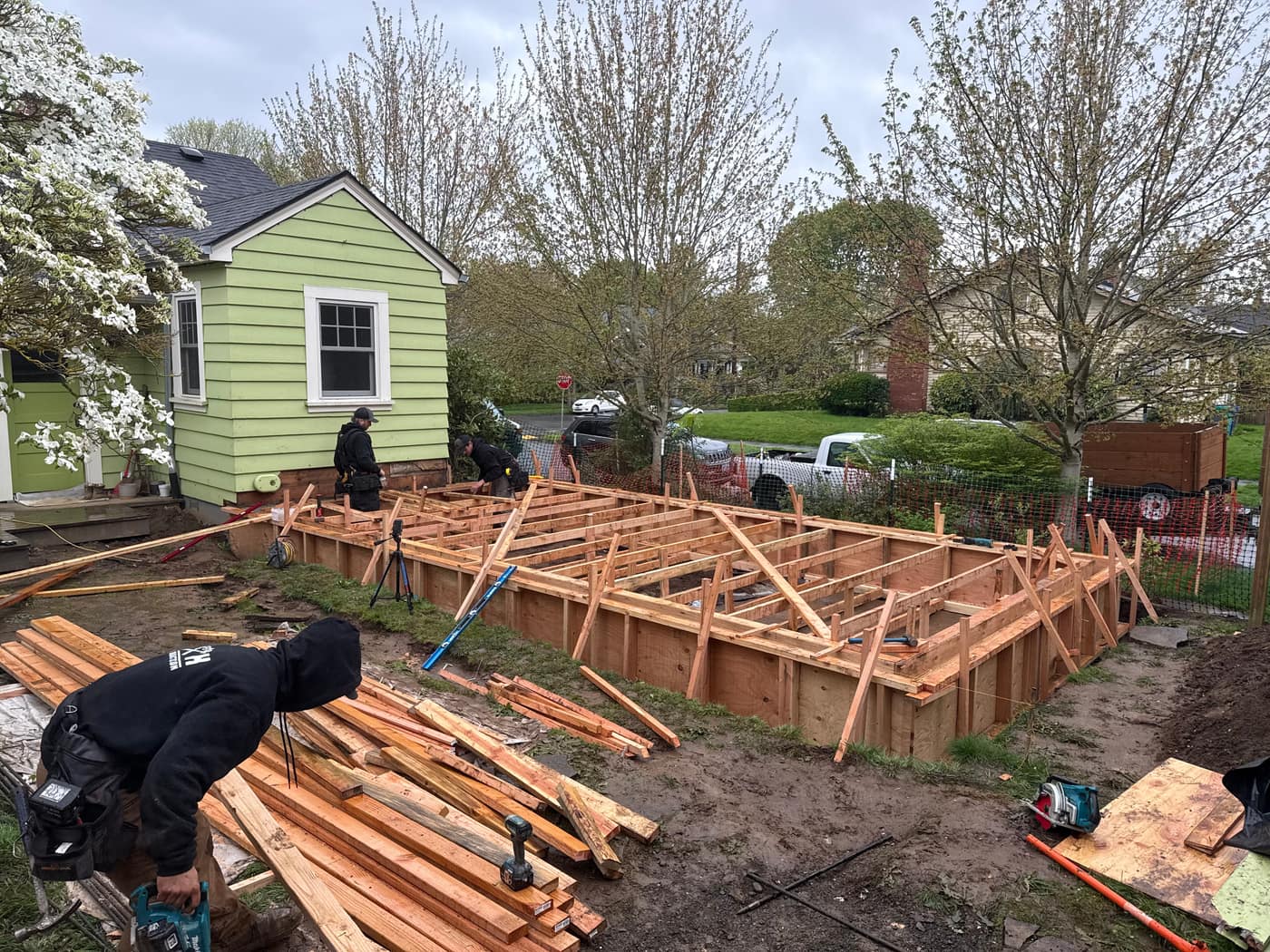 Foundation forms and floor framing for a detached ADU in a NE Portland backyard — K&H Construction