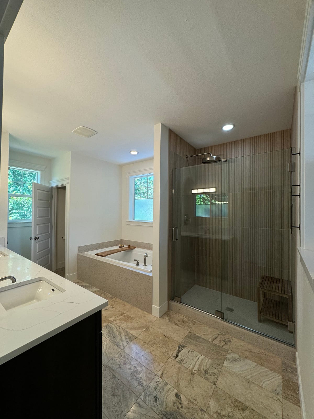 West Slope master bathroom remodel near Lake Oswego, OR: frameless glass walk-in shower and deck-mounted soaking tub by K&H Construction (after)
